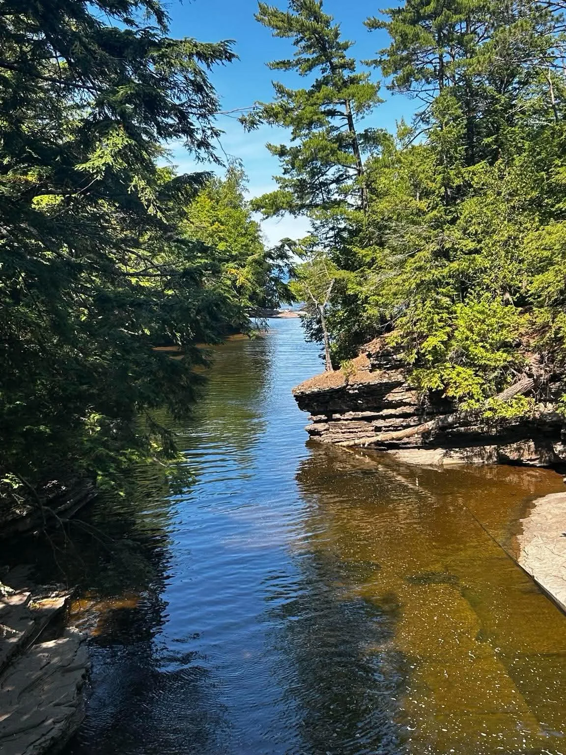 Presque Isle River flowing through a forest toward Lake Superior